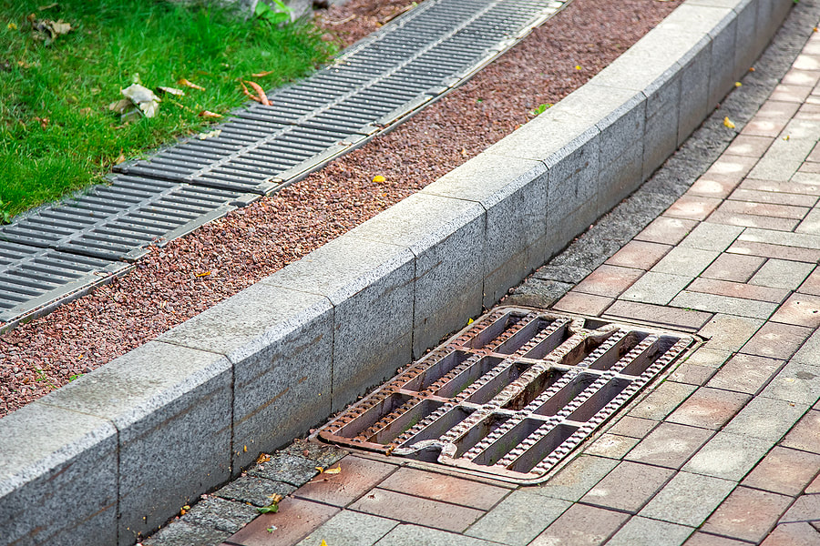 sidewalk with exterior french drain